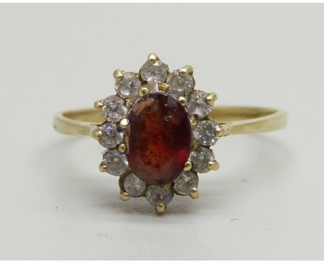 A 9ct gold, garnet and white stone cluster ring, 1.9g, R/S 