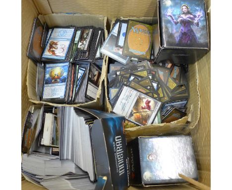 A box of Magic The Gathering gaming/playing cards 