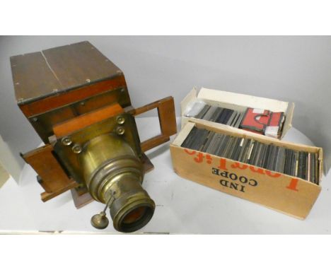 A part Magic Lantern projector and a collection of Magic Lantern slides (117) including travel, children's stories and battle