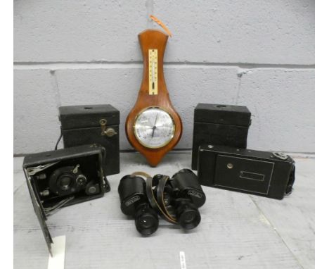 A box of cameras, binoculars and a barometer **PLEASE NOTE THIS LOT IS NOT ELIGIBLE FOR POSTING AND PACKING** 