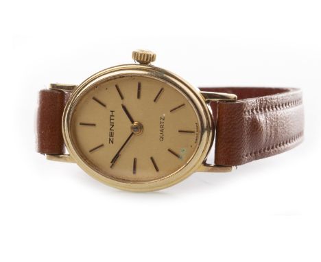 LADY'S ZENITH NINE CARAT GOLD QUARTZ WRIST WATCH, the oval gold coloured dial with applied baton hour markers, 21mm case, on 