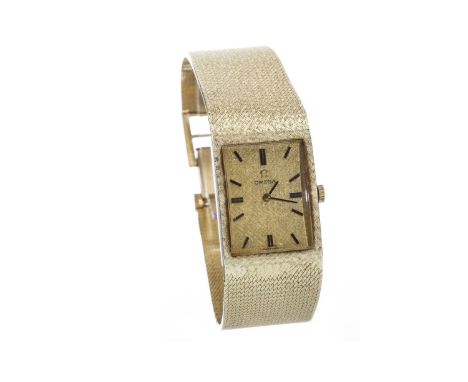 GENTLEMAN'S OMEGA GOLD MANUAL WIND WRIST WATCH, signed Omega movement, the rectangular gold coloured dial etched and with app