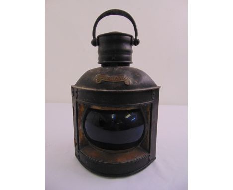 A vintage metal case and glass ships lamp with carrying handle