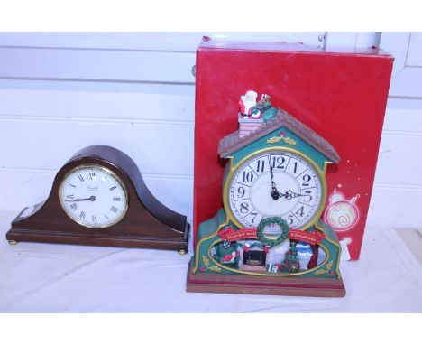 A boxed novelty Christmas clock and a vintage style mantle clock 
