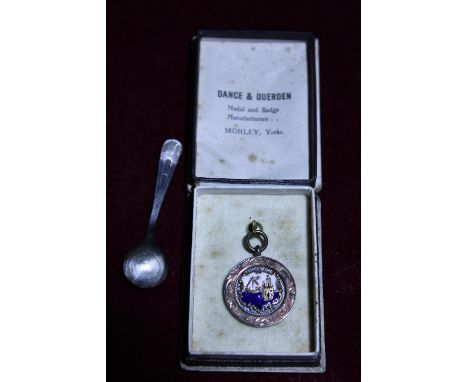 A hallmarked silver and enamel medal and a hallmarked silver mustard spoon 