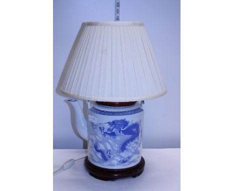 A Chinese porcelain lamp base in the form of a teapot, shipping unavailable 