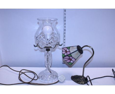 A hurricane style glass lamp and a Tiffany style glass lamp 