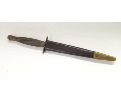 Reproduction commando fighting knife made by William Rodgers, Sheffield, England, stamped to cross guard, together with leath