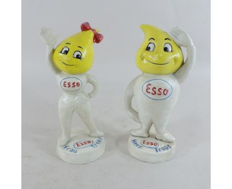 A pair of painted metal Esso money banks, 23cm tall 