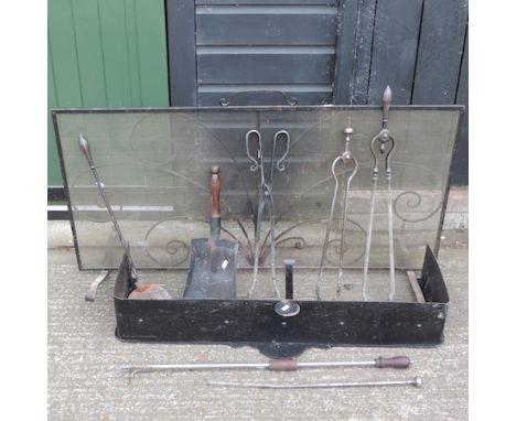 A 19th century steel fender, 100cm, together with a spark guard and various fire tools