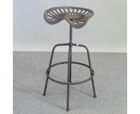 A revolving metal tractor seat bar stool 
