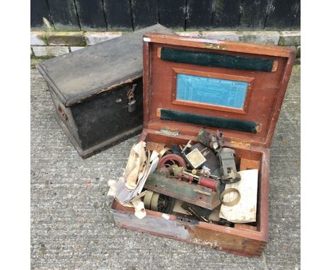 A wooden box, 66cm, containing stationary engine parts, together with another