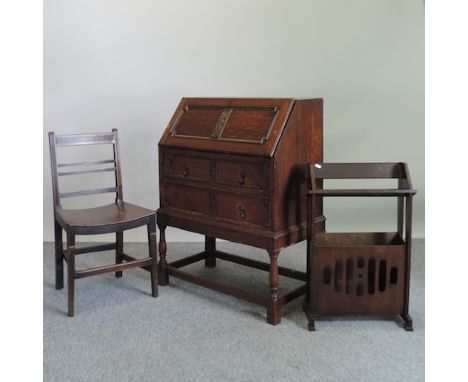 A 1920's oak bureau, 74cm, together with an oak dining chair and a book trough 