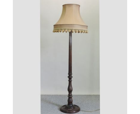 A carved mahogany standard lamp and shade, 176cm tall 