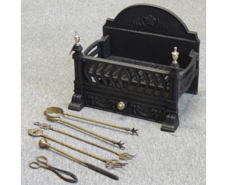 A cast iron and brass mounted fire grate, 46cm, together with fire tools