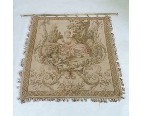 A tapestry hanging of a pastoral scene, on a brass rail, 165cm