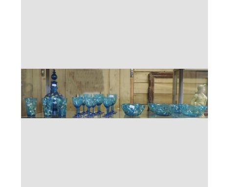 A 19th century continental blue glass liqueur set, with painted decoration, to include drinking glasses, bowls and a decanter
