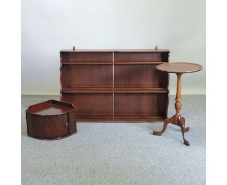 A 19th century mahogany three tier wall shelf, 98cm, together with a wine table and a hanging corner cupboard 