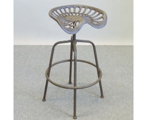 A revolving metal tractor seat bar stool 