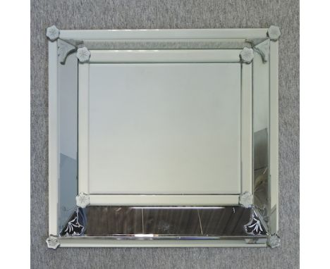 A modern cushion framed wall mirror, 85 x 70cm overall
