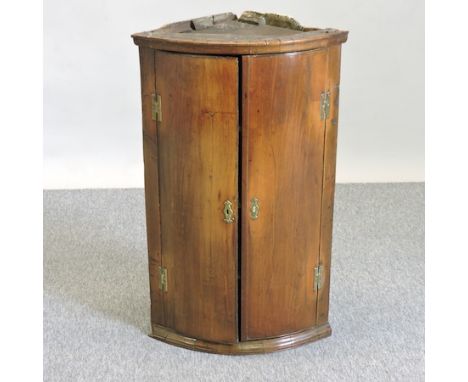 A George III mahogany bow front hanging corner cabinet, 56cm 