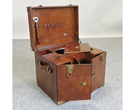 A brown leather champagne hamper, with a fitted interior, 42cm wide