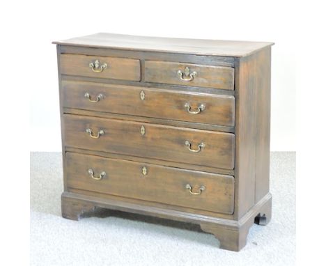 A George III oak chest, containing two short above three long drawers, on bracket feet, 95cm