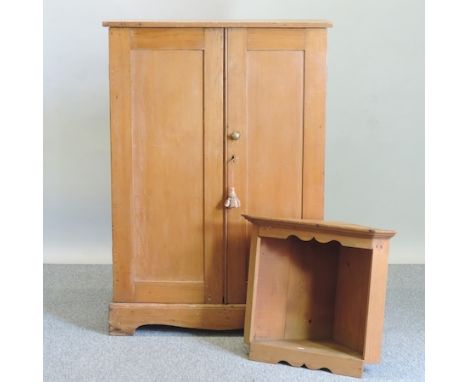 A 19th century pine cupboard, the interior fitted with pigeon holes, 86cm, together with a small pine corner shelf