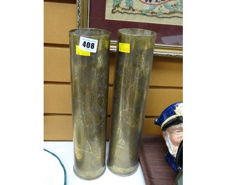 A pair of decorated brass artillery shells