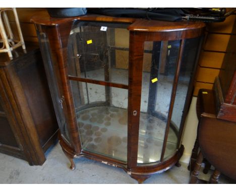 A polished china cabinet, a leather (or effect) pouffe, sundry bamboo, rattan tables etc