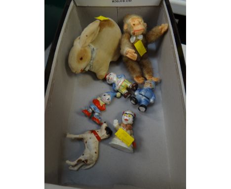 A vintage rabbit pin cushion, a small soft toy monkey & three believed Wade Noddy figures etc