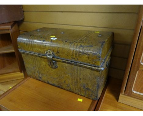 A small metal vintage tin trunk
