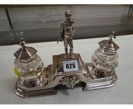 A fine quality EPNS equestrian themed desk stand with mounted jockey knop to a sliding covered inkwell (beware flanking jars 
