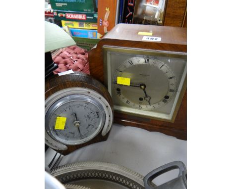 A polished mantel clock & similar horseshoe barometer