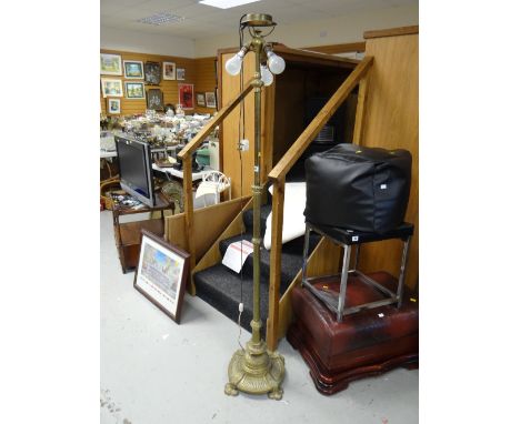 An antique brass three-branch telescopic standard lamp E/T 