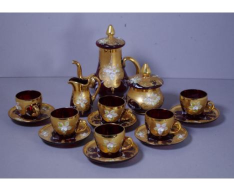 Venetian glass coffee set with gilt and floral decoration, consisting of a coffee pot, creamer, sugar and six cups and saucer