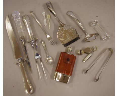 Quantity silver plated cutlery including carving knife & fork; 2 various pairs tongs; letter opener; ladle; etc.