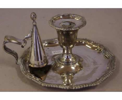 Early silver plated chamber stick together with fitted snuffer.