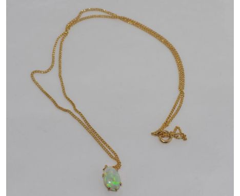 Opal pendant in a 9ct gold surround on a gold plated chain