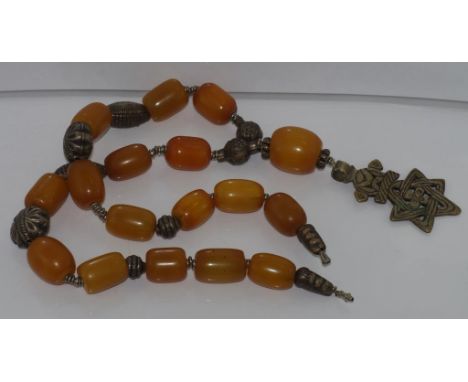 Vintage yellow bead necklace separated by decorative metal disks