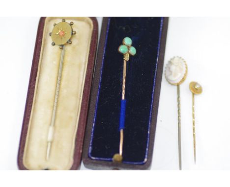 Boxed 9ct gold & cameo stick pin together with three other stick pins (2 which some 9ct gold)