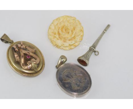 Two vintage lockets with a vintage watch key and brooch