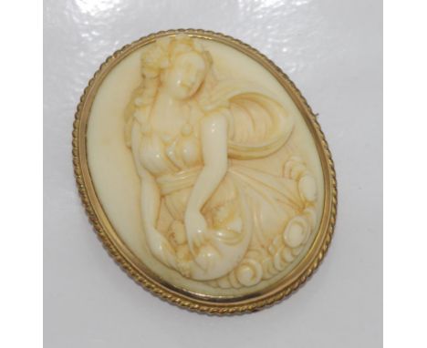 Victorian carved ivory brooch in gilt metal surround. (NB this item may not be exported without CITES documentation)