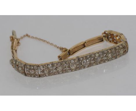 18ct two tone gold and diamond bracelet stamped "18ct" "Englishmade", total weight: 15 grams, 83 mixed cut old diamonds & mod