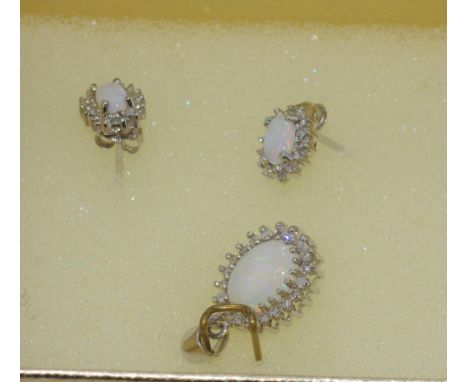White gold and opal small pendant and earrings stamped 10k