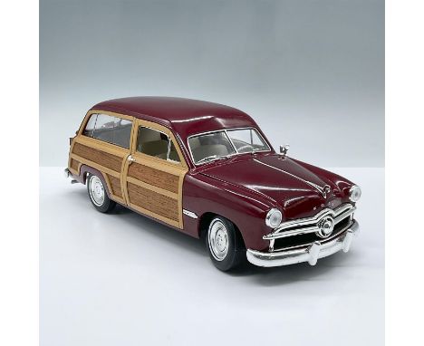 Maroon and wooden model car with a spare tire attached to rear. The two doors and hood can open to expose the engine and whit