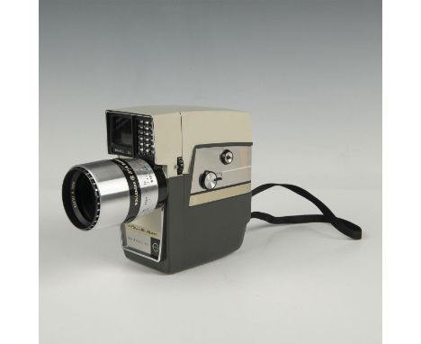 Wollensak Model C-79 Power-Zoom 8mm Fully Automatic with Magazine Load Focusing Mount Zoom Lens Movie Camera. It has a Wollen