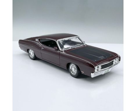 This classic maroon model car feature a black interior and moving parts including the two doors, the trunk, the hood. and a f
