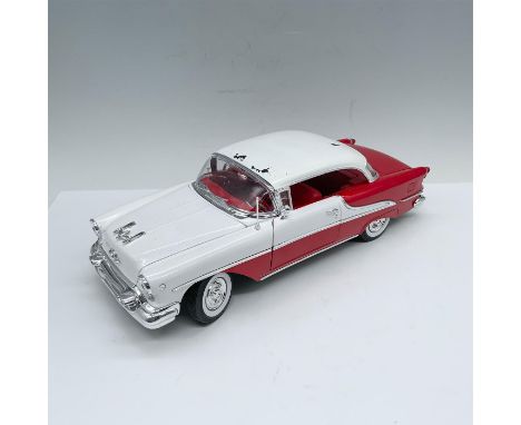 Amazing depiction of classic red and white car with red interiors and whitewall tires. Driver and passenger doors open as wel