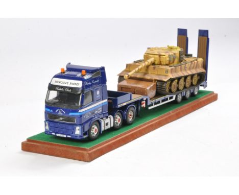 Corgi Volvo Low Loader in the Livery of Metcalfe Farms with Tank Load. Generally good to very good, some display wear. Comes 